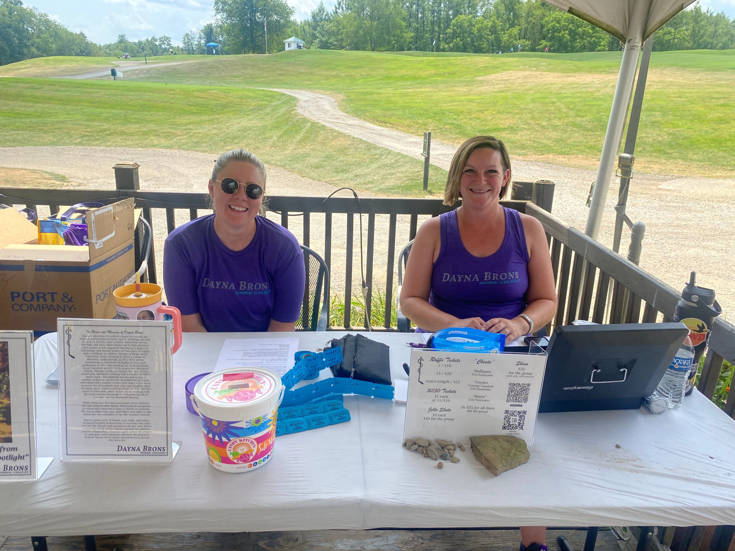 volunteers behind the registration table at a golf outing